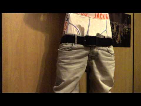 Sagging in shirt and grey jeans