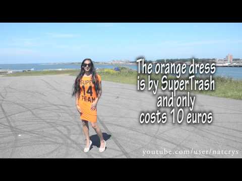Crossdresser – football in an orange dress and white peeptoe pumps