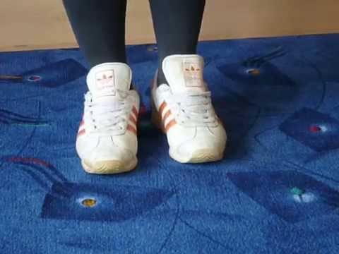 Jana shows her Adidas sneaker white orange