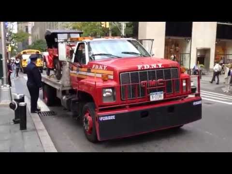 FDNY FLATBED TRUCK CARRYING A 1924 FDNY BATTALION CHIEFS UNIT AT KICKOFF OF FIRE PREVENTION WEEK.