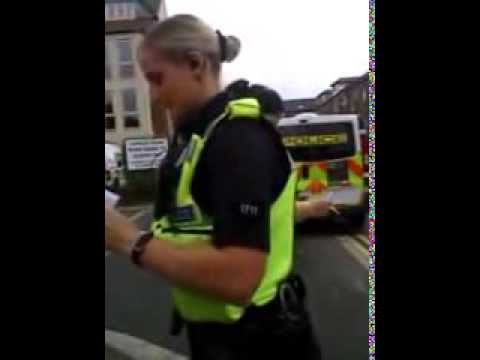 female police officer orders a bystander to stop filming